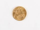a gold coin with a picture of a man riding a horse