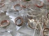 a lot of rings in the bag on the table