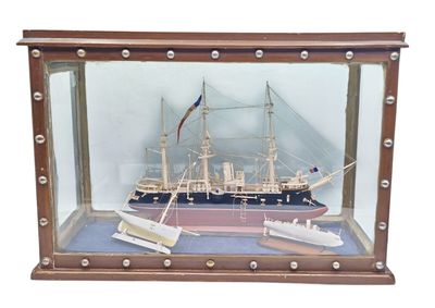 a model of a ship in a glass case