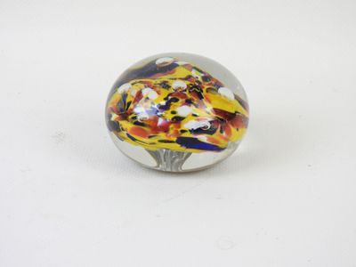 glass marble ball with multicolored design on white surface