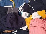 a lot of clothes that are on a table