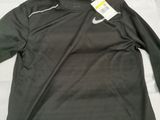 a close up of a black shirt with a tag on it