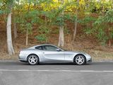 a silver sports car parked on the side of the road