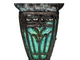 an image of a green vase with a decorative design on it