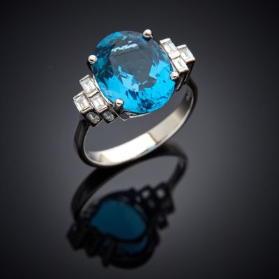 an oval blue topaze and diamond ring