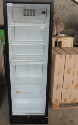 a refrigerator that is sitting in the middle of a room