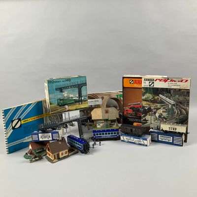 a lot of toy trains and books on the table