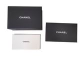 a black box with a white and black logo on it