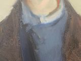 portrait of a young man in a blue shirt and brown jacket