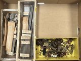 a box full of assorted metal items in it