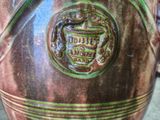 a close up of a vase with a coat of arms on it