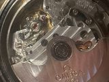 an image of a close up of a person ' s hand holding a watch