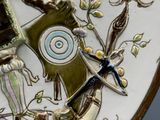 a picture of a decorative plate with a bird and flowers on it