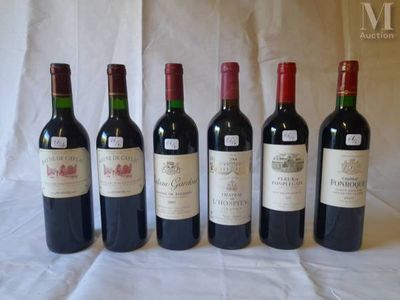 six bottles of wine are lined up on a table