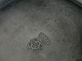 a silver plate with a crown and a crown on it