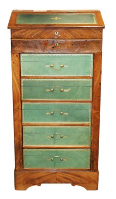 an old wooden chest of drawers with a green glass top