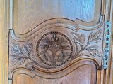 a wooden door with a carved design on it