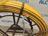 a yellow hose that is attached to a wire