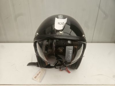 a black helmet with a tag on it sitting on a table
