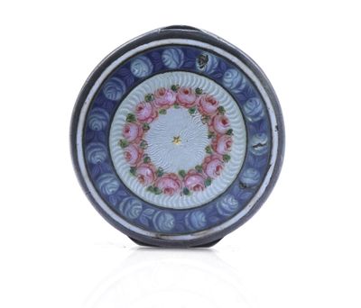 a blue and white plate with pink flowers on it