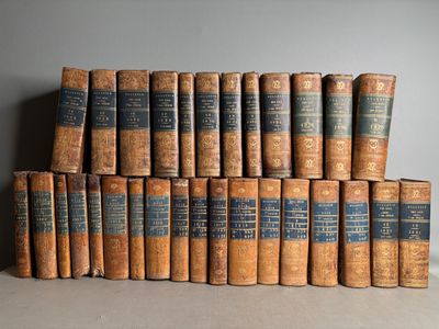 a bunch of old books stacked on top of each other