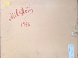 an old book with writing on it sitting on top of a table