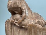statue of a woman holding a baby in her arms