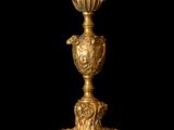 an image of a gold vase on a black background with a black background