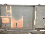 an old suitcase with a teddy bear inside of it