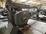 a picture of a machine in a factory that is being worked on