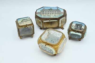 several pieces of jewelry sitting on top of a table next to each other