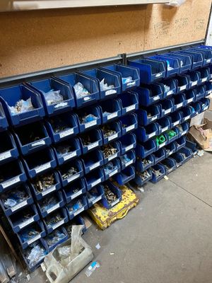 many bins of assorted items on the floor