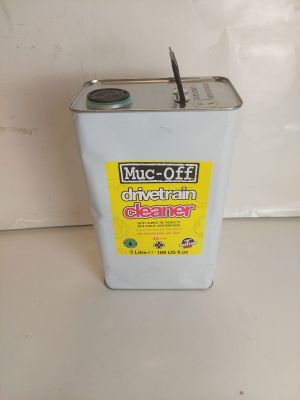 a canister of muc off cleaner sitting on a counter
