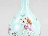 a blue vase with a picture of a girl and a dog on it