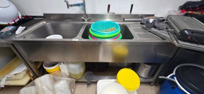 a sink with a lot of dirty dishes in it