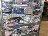 a metal cart with many items in it in a warehouse