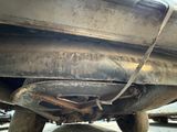 a close up view of a car with a broken exhaust pipe