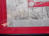 a picture of a red frame with a picture of a man on a horse
