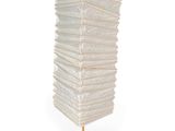 a large stack of paper bags on a wooden stand