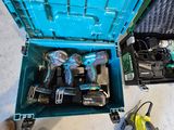 a blue box with tools inside of it on the floor