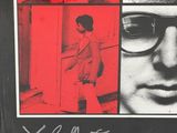 a picture of a poster with a man in glasses on it