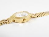 an image of a close up of a gold watch on a chain