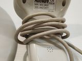 a cord that is connected to a device on top of a table