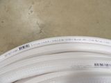 a close up of a white hose on the floor
