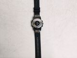 a watch that is laying on a white surface