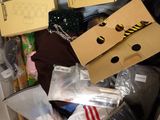 a pile of clothes and other items in a box