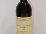 a bottle of wine that is sitting on a table