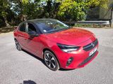 a picture of a red car parked in a parking lot