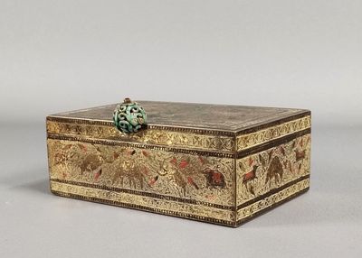 a small box with a decorative decoration on it