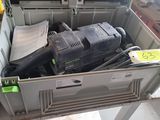 a box full of electrical equipment that is sitting on the floor